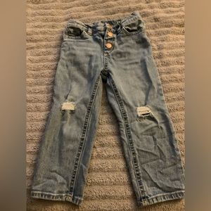 Girl distressed denim jeans.